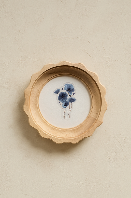 Decorative wall art with blue flowers in a wooden frame on a beige background