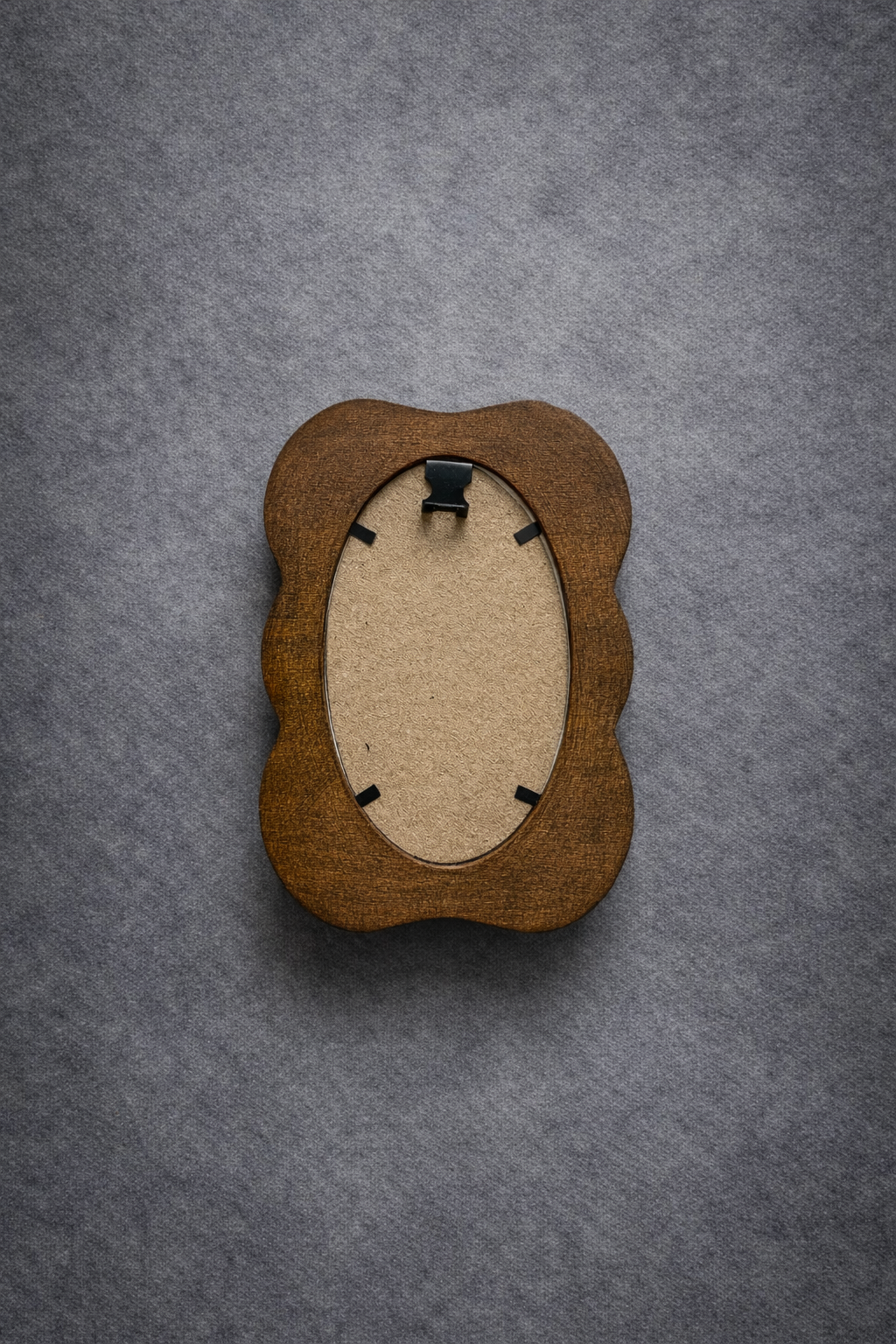 Wooden picture frame on a gray textured background