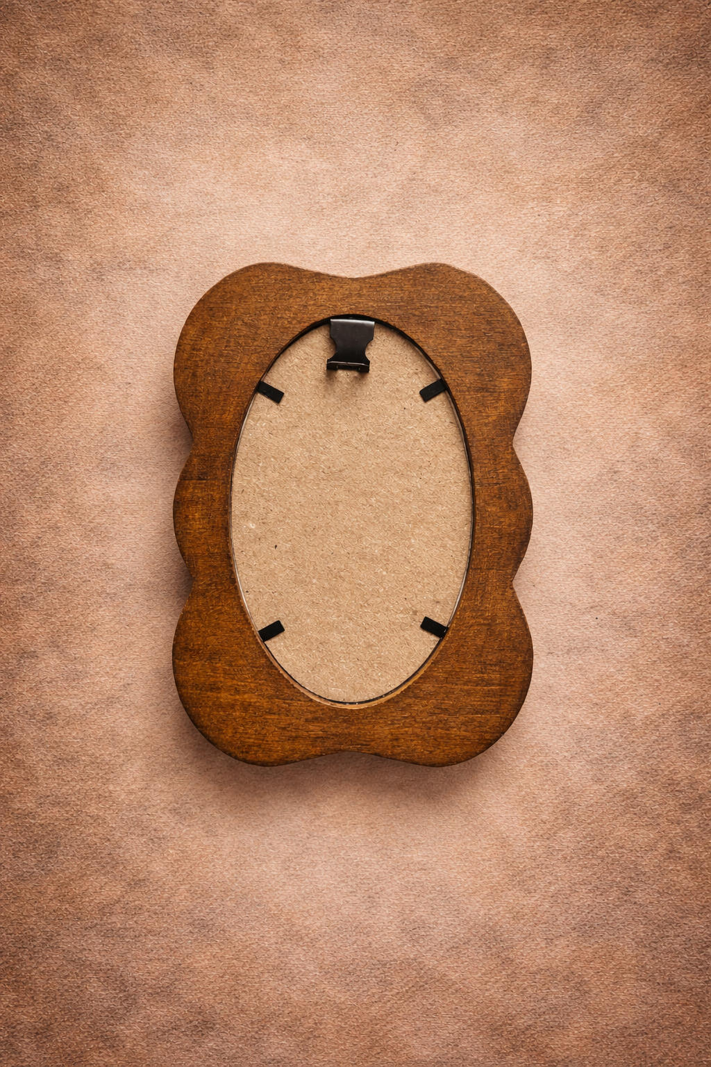Wooden picture frame on a brown textured background