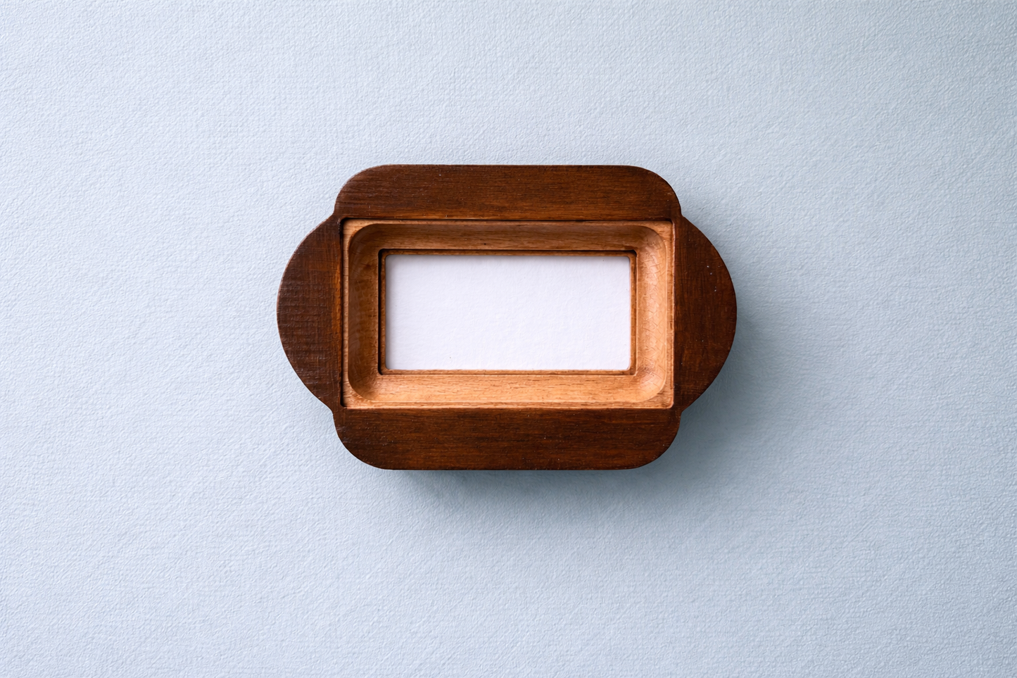 Wooden picture frame on a light gray background