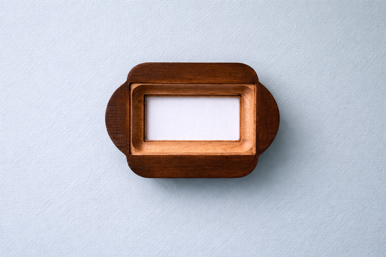 Wooden picture frame on a light gray background