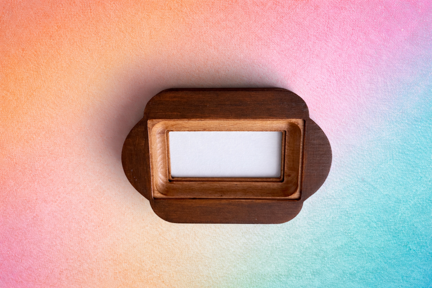 Wooden frame on a colorful gradient background