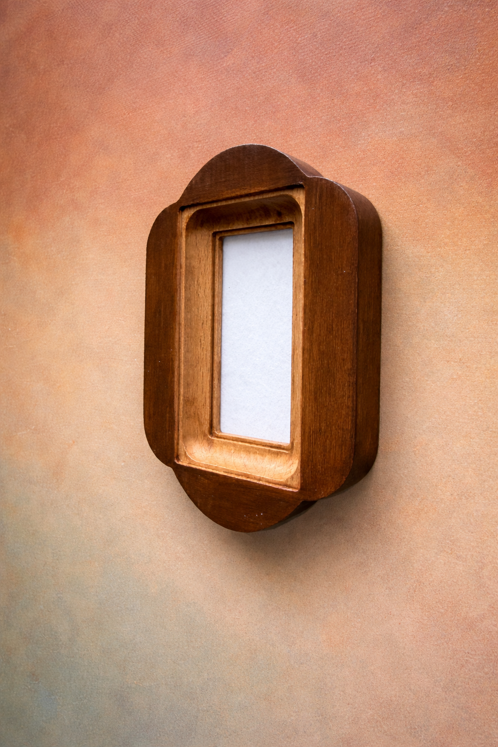 Wooden photo frame on a textured wall