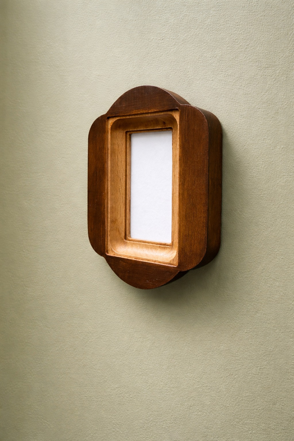 Wooden wall frame on a beige wall