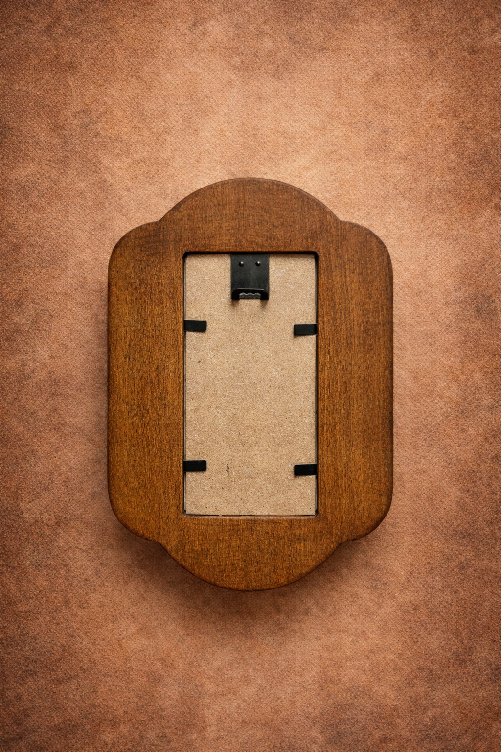 Wooden picture frame on a brown background