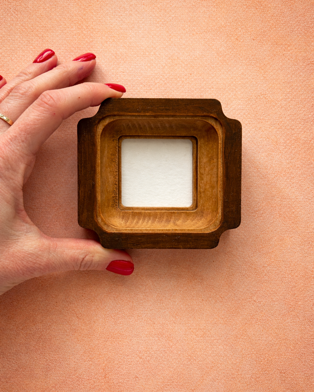 Wooden photo frame in a hand