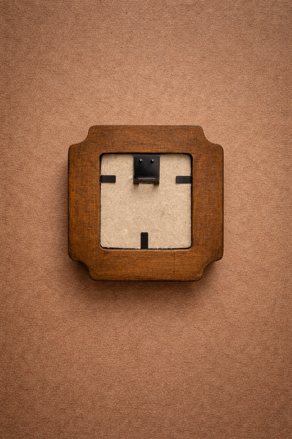 Wooden wall face with a square face on a brown background