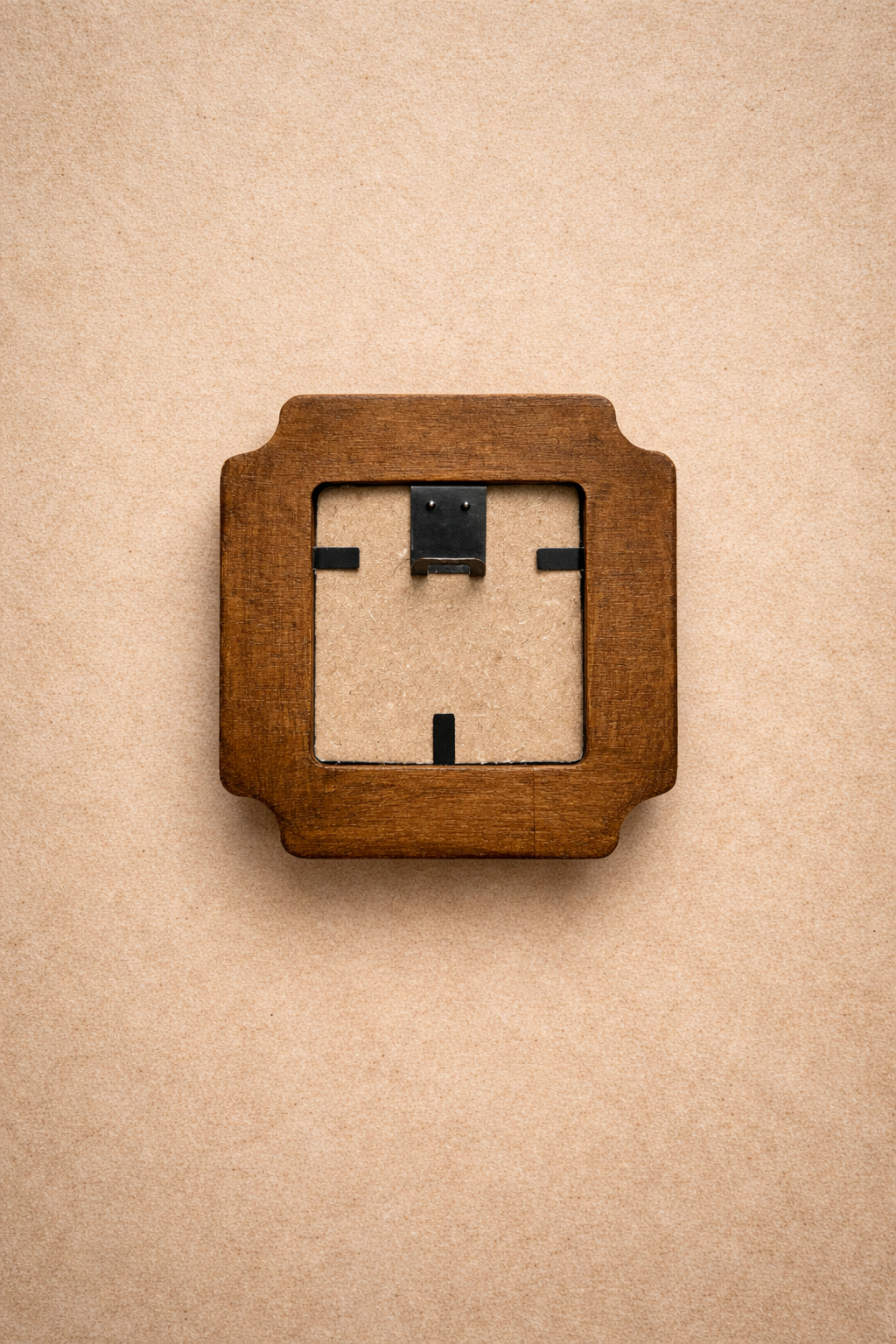 Wooden frame with a white face on a beige background