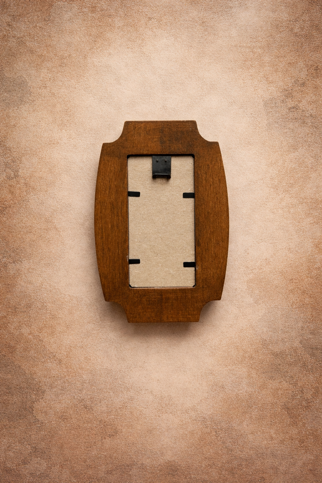 Wooden picture frame on a beige textured background