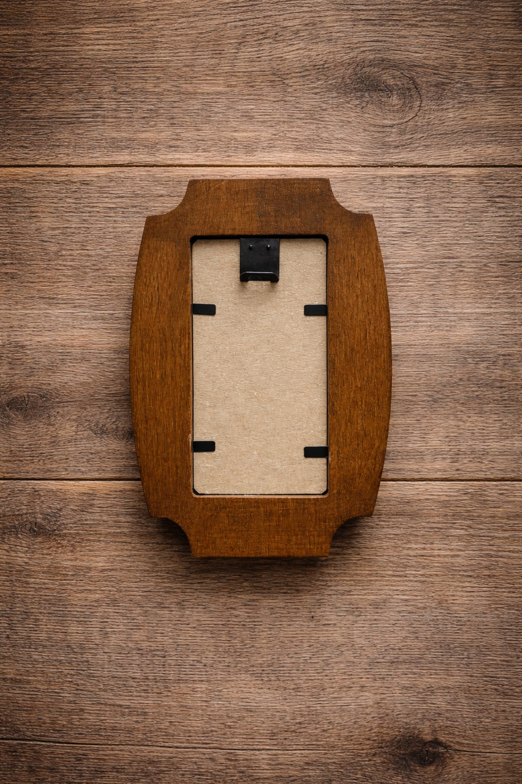 Wooden picture frame on a wooden surface