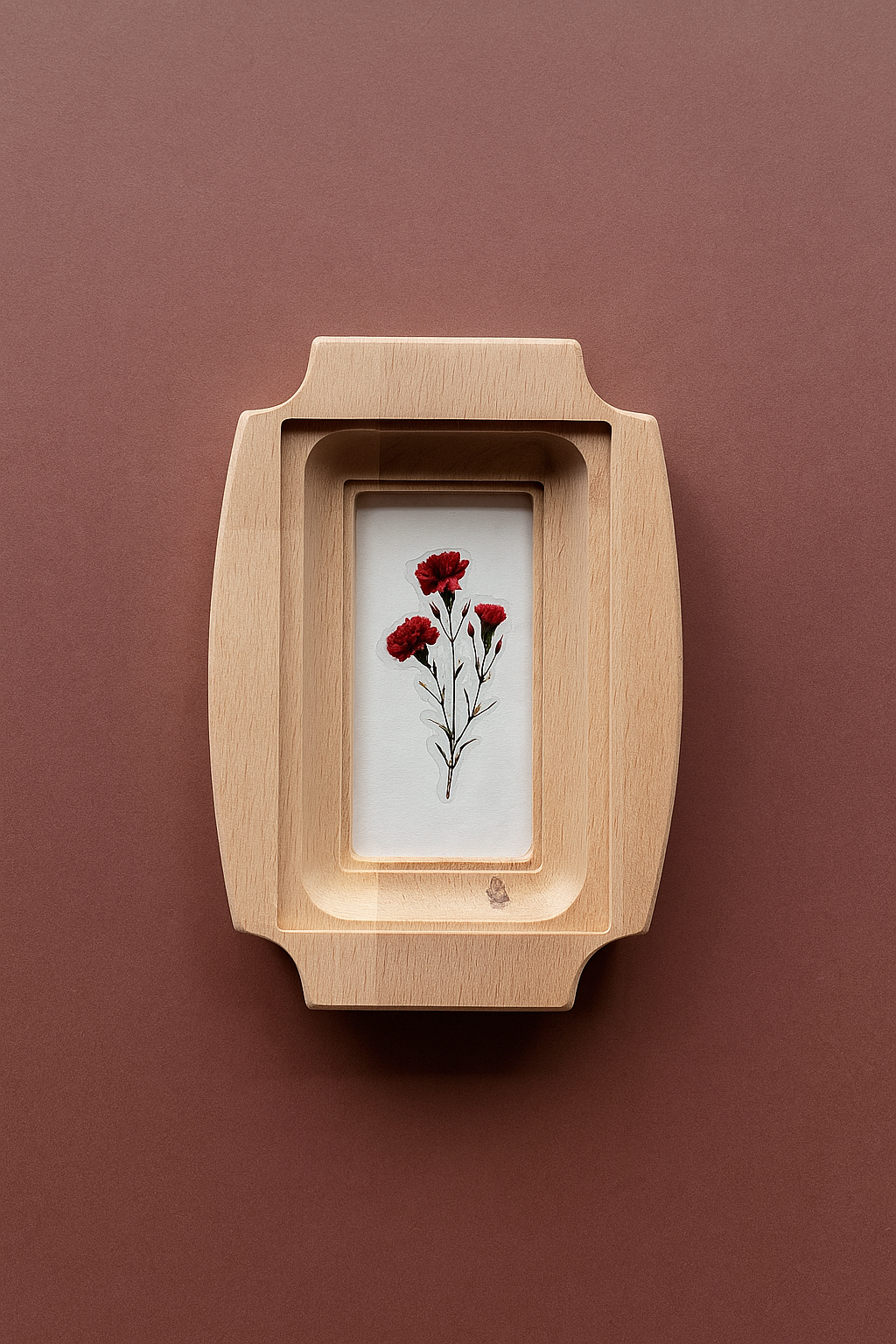 Wooden frame with a small painting of red flowers on a brown background