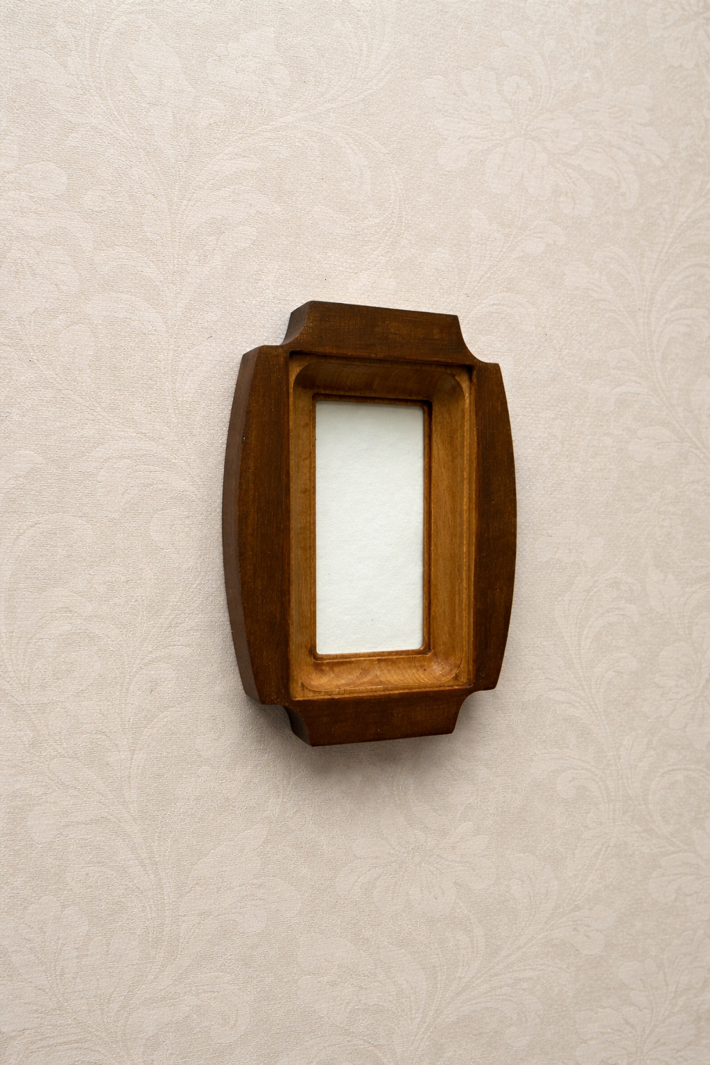 Wooden photo frame a beige textured wall